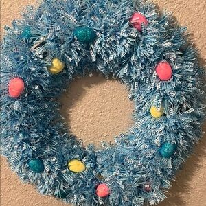 Vibrant Blue Easter Wreath with Colorful Eggs